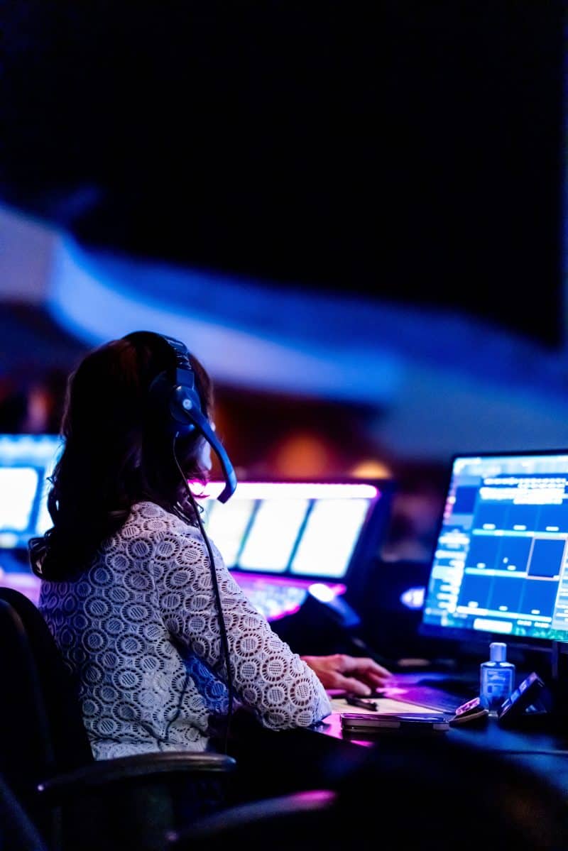 A church media operator preparing presentations at the production desk